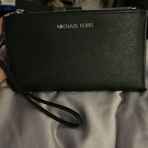 Michael Kors. Super cute never used wristlet. Black